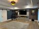 Living room featuring a modern electric fireplace, hardwood floors, and a TV at 839 Braselton Hwy, Lawrenceville, GA 30043