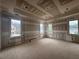 Spacious unfinished living room with ample natural light and custom ceiling design at 839 Braselton Hwy, Lawrenceville, GA 30043