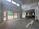Spacious room features high ceilings, large windows, and open access to the kitchen and pool view at 839 Braselton Hwy, Lawrenceville, GA 30043