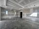 Bright living room with tray ceilings, awaiting personalized finishes to make it your own at 839 Braselton Hwy, Lawrenceville, GA 30043