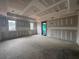 Unfinished living room with windows allowing natural light and a door leading to the outdoors at 839 Braselton Hwy, Lawrenceville, GA 30043