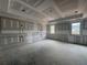Unfinished main bedroom features decorative molding and large windows for lots of natural light at 839 Braselton Hwy, Lawrenceville, GA 30043
