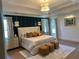 Spacious main bedroom with tray ceilings, stylish lighting, and elegant furniture at 839 Braselton Hwy, Lawrenceville, GA 30043