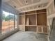 Spacious office featuring custom built-in shelves, cabinets, and a large window at 839 Braselton Hwy, Lawrenceville, GA 30043