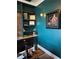 Office space with a built-in shelf, sleek desk, and a decorative painting at 839 Braselton Hwy, Lawrenceville, GA 30043