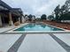 Inviting backyard features a large pool, spa, and patio area with pavers at 839 Braselton Hwy, Lawrenceville, GA 30043