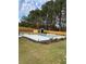 Beautiful pool area with a pool house, modern design, and privacy fencing at 839 Braselton Hwy, Lawrenceville, GA 30043