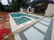 Backyard boasts a large pool, spa, and patio surrounded by modern concrete pavers at 839 Braselton Hwy, Lawrenceville, GA 30043