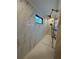 Modern shower stall with elegant tile work, window and high-end fixtures at 839 Braselton Hwy, Lawrenceville, GA 30043