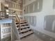 Staircase leading to the second floor is under construction and shows the home building process at 839 Braselton Hwy, Lawrenceville, GA 30043