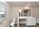 Bathroom boasts a vanity with a large mirror and a toilet at 518 Firethorn Ct, Villa Rica, GA 30180