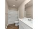Clean bathroom featuring a tub, toilet, and vanity with a mirror at 518 Firethorn Ct, Villa Rica, GA 30180