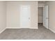 Empty bedroom with gray carpet, white doors and a closet at 518 Firethorn Ct, Villa Rica, GA 30180