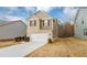 Two-story house with brick and siding, two-car garage, and landscaping at 518 Firethorn Ct, Villa Rica, GA 30180
