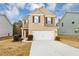 Two-story house with brick and siding, two-car garage, and landscaping at 518 Firethorn Ct, Villa Rica, GA 30180