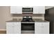 Kitchen with stainless steel appliances and granite countertops at 518 Firethorn Ct, Villa Rica, GA 30180