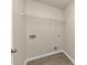 Laundry room with wire shelving and vinyl flooring at 518 Firethorn Ct, Villa Rica, GA 30180