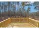 New wooden backyard deck overlooking a scenic wooded lot at 7260 Eton Ln, Locust Grove, GA 30248