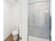 Bathroom features a tile shower with glass door at 7260 Eton Ln, Locust Grove, GA 30248