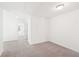 Bright bedroom featuring neutral carpet, white walls, and a ceiling light at 7260 Eton Ln, Locust Grove, GA 30248