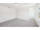Well-lit bedroom featuring a neutral carpet and a window at 7260 Eton Ln, Locust Grove, GA 30248