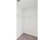 Walk-in closet with white wire shelving and neutral carpet at 7260 Eton Ln, Locust Grove, GA 30248