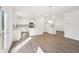 Spacious eat-in kitchen featuring white cabinets, stainless steel appliances, a center island and backyard access at 7260 Eton Ln, Locust Grove, GA 30248