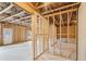 Unfinished basement with wood framing, exposed insulation, and concrete floor at 7260 Eton Ln, Locust Grove, GA 30248