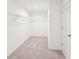 Spacious walk-in closet with carpet flooring and wire shelving at 7260 Eton Ln, Locust Grove, GA 30248