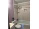 Bathroom with tiled tub/shower combination and neutral color scheme at 3557 Clubhouse Ln, Conyers, GA 30094