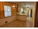 Eat-in kitchen area featuring tile floors, traditional cabinets, and retro appliances at 3557 Clubhouse Ln, Conyers, GA 30094