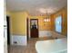 Kitchen featuring tile floors, light fixture, and white cabinets and countertops at 3557 Clubhouse Ln, Conyers, GA 30094