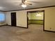 This living room features neutral carpeting and an opening into a dining area at 3557 Clubhouse Ln, Conyers, GA 30094