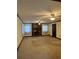 Spacious living room features brick fireplace, ceiling fans and neutral carpet at 3557 Clubhouse Ln, Conyers, GA 30094