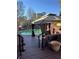 Outdoor pool with gazebo and lounge seating on a wood deck at 3557 Clubhouse Ln, Conyers, GA 30094