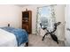 Serene bedroom with a bed, exercise bike and window at 7787 Richmond Trl, Fairburn, GA 30213