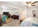 Spacious main bedroom with sitting area and access to walk-in closet at 7787 Richmond Trl, Fairburn, GA 30213