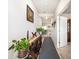 Bright entryway with console table, plants, and view to dining area at 7787 Richmond Trl, Fairburn, GA 30213