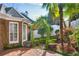 Brick patio with lush landscaping, including a charming arbor and boxwood hedges at 3175 Weston Nw Pl, Atlanta, GA 30327