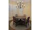 Elegant dining room featuring a round table, chandelier, and hardwood floors at 3175 Weston Nw Pl, Atlanta, GA 30327