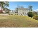 Two-story house on a hill with a large yard at 3937 Ashford Dunwoody Ne Rd, Brookhaven, GA 30319