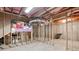 Unfinished basement with framing and storage area at 2041 Democracy Dr, Buford, GA 30519