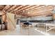 Unfinished basement with exposed beams and workshop area at 2041 Democracy Dr, Buford, GA 30519