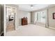 Spacious bedroom with ceiling fan, window and dresser at 2041 Democracy Dr, Buford, GA 30519