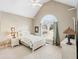 Spacious bedroom with vaulted ceiling, large window, and white furniture at 2041 Democracy Dr, Buford, GA 30519