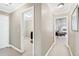 Bright hallway with doors to bedrooms and an office at 2041 Democracy Dr, Buford, GA 30519