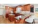 Granite countertop kitchen island, hardwood floors, and ample cabinet space at 2041 Democracy Dr, Buford, GA 30519