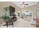 Spacious living room with hardwood floors, neutral decor, and large windows at 2041 Democracy Dr, Buford, GA 30519