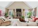 Spacious living room features a stone fireplace and hardwood floors at 2041 Democracy Dr, Buford, GA 30519