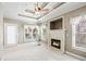 Living room with fireplace, large windows, and access to outdoor patio at 2041 Democracy Dr, Buford, GA 30519
